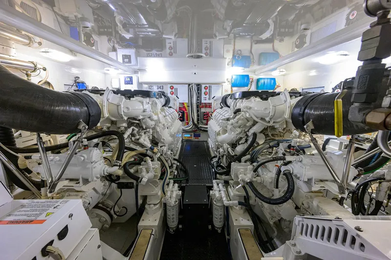 Slide: The Image of Engine room of 2015 Viking 52 Open yacht, showcasing dual engines and mechanical systems. - 78