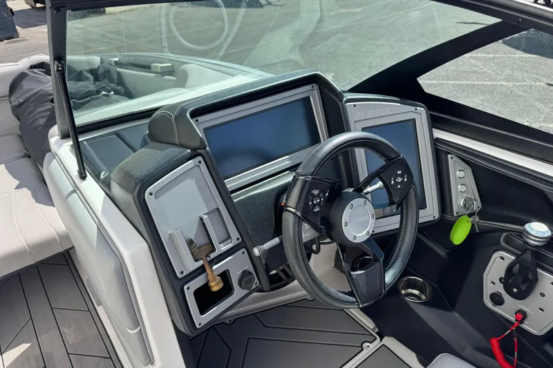 Slide: The Image of 2019 Supra SE 575 boat dashboard with steering wheel and digital displays. - 8