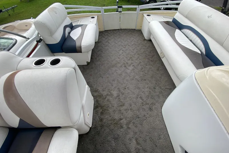 Slide: The Image of Interior of 2010 JC NEPTOON 19 pontoon boat with cushioned seating and carpeted floor. - 15
