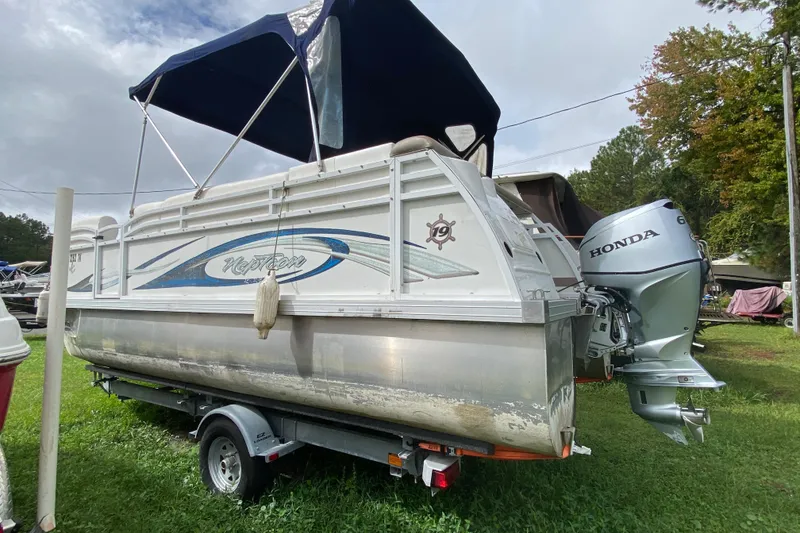 Slide: The Image of 2010 JC NEPTOON 19 pontoon boat with Honda outboard motor on trailer. - 4