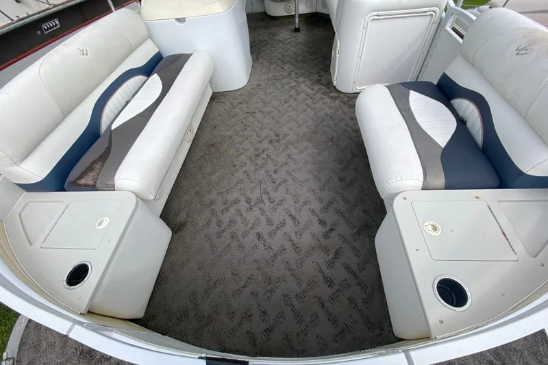 Slide: The Image of Interior of 2010 JC NEPTOON 19 boat with white and blue seating. - 7
