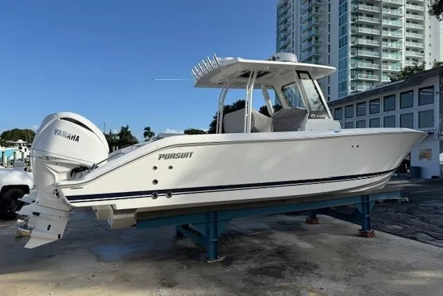 The Image of 2025 Pursuit S 288 Sport boat on display with Yamaha engine. - 0