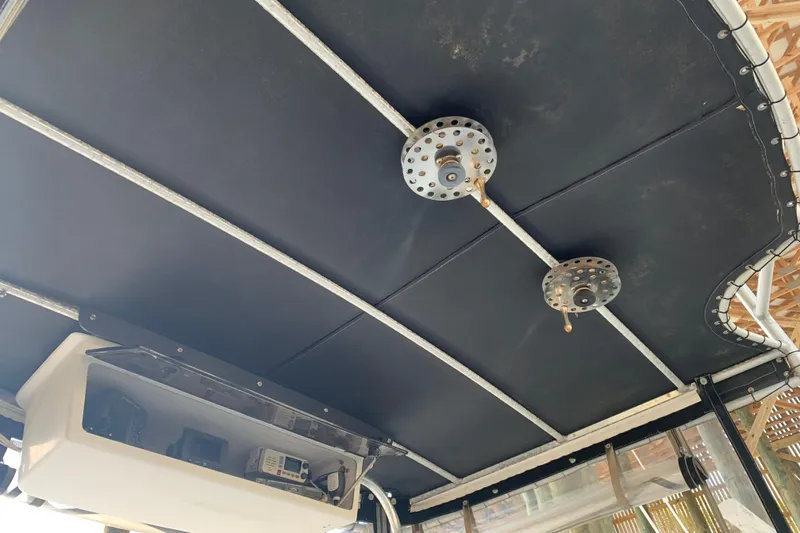 Slide: The Image of 1974 Bertram 31 Flybridge Cruiser interior ceiling with equipment and wiring. - 17