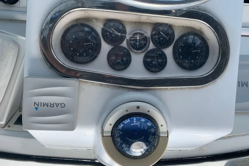 Slide: The Image of Dashboard of a 1974 Bertram 31 Flybridge Cruiser with Garmin navigation and compass. - 22