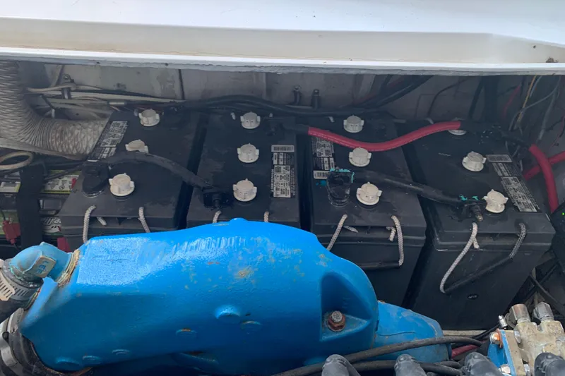 Slide: The Image of Battery compartment of a 1974 Bertram 31 Flybridge Cruiser with visible wiring and components. - 30