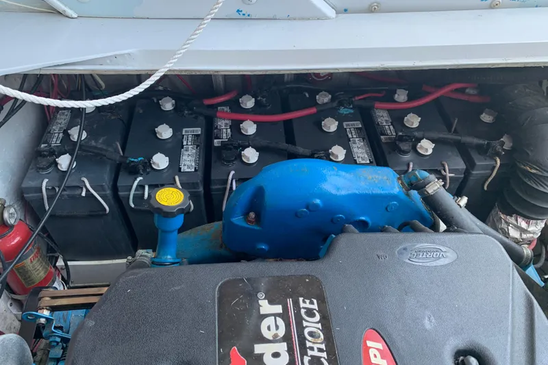 Slide: The Image of Engine compartment of a 1974 Bertram 31 Flybridge Cruiser with batteries and wiring. - 37