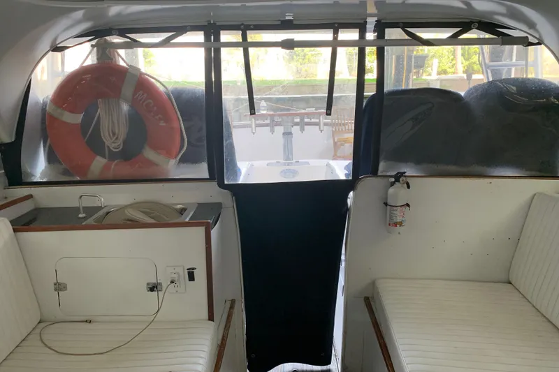 Slide: The Image of Interior of a 1974 Bertram 31 Flybridge Cruiser with seating and safety equipment. - 44
