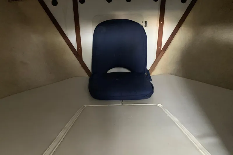 Slide: The Image of 1974 Bertram 31 Flybridge Cruiser interior with blue seat cushion. - 45