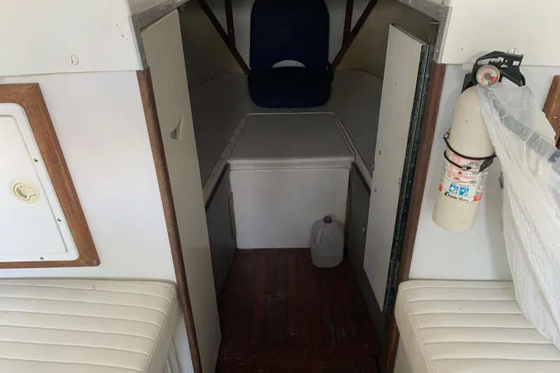 Slide: The Image of Interior of a 1974 Bertram 31 Flybridge Cruiser with seating and storage. - 51