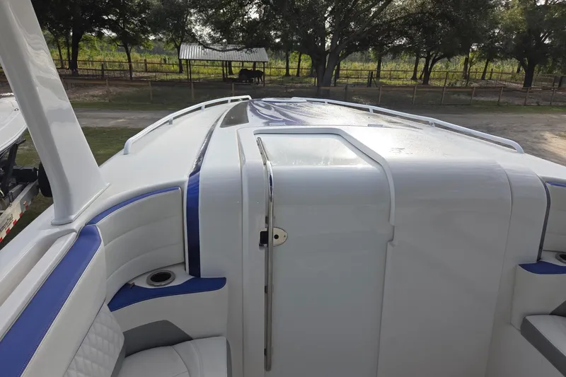 Slide: The Image of 2019 Concept 44' Cuddy Cabin boat with sleek white and blue design. - 21