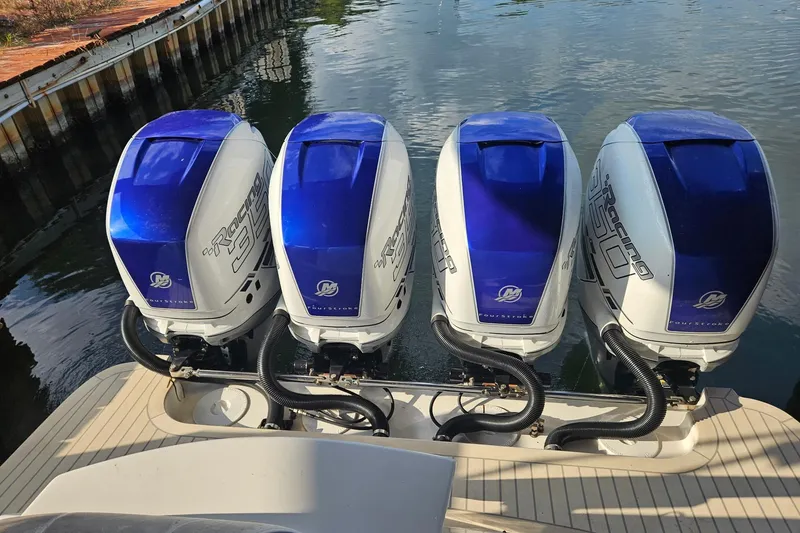 Slide: The Image of Four powerful outboard engines on a 2019 Concept 44' Cuddy Cabin boat. - 12