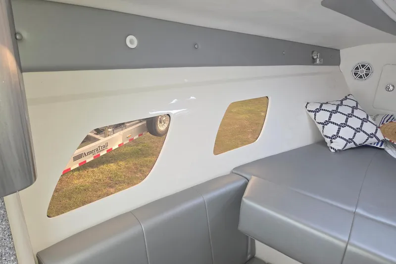Slide: The Image of Interior of 2019 Concept 44' Cuddy Cabin with modern seating and decorative pillows. - 27