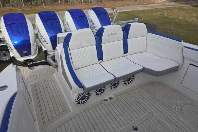 Slide: The Image of 2019 Concept 44' Cuddy Cabin boat with blue and white seating and powerful engines. - 19