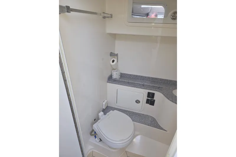 Slide: The Image of Modern bathroom in 2019 Concept 44' Cuddy Cabin boat, featuring compact toilet and storage. - 25