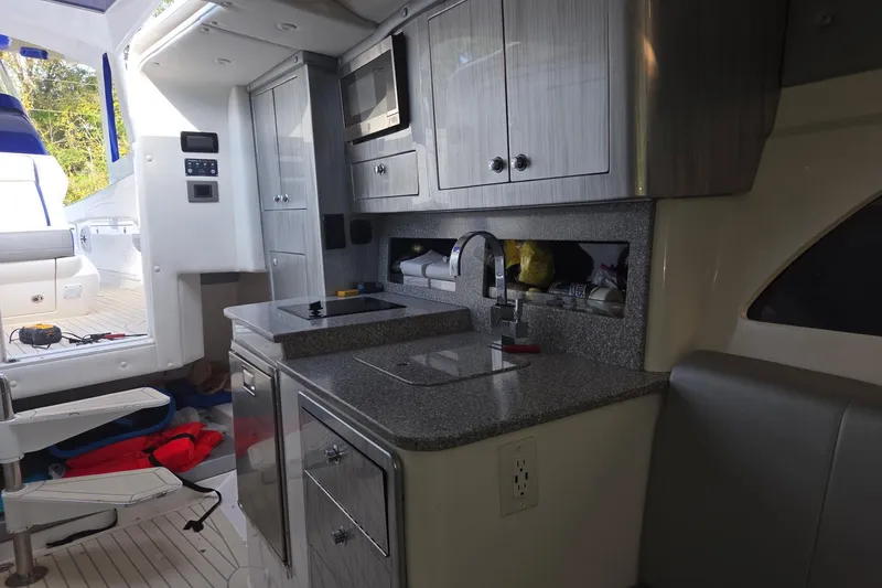 Slide: The Image of Luxurious 2019 Concept 44' Cuddy Cabin interior with modern kitchenette and sleek design. - 23