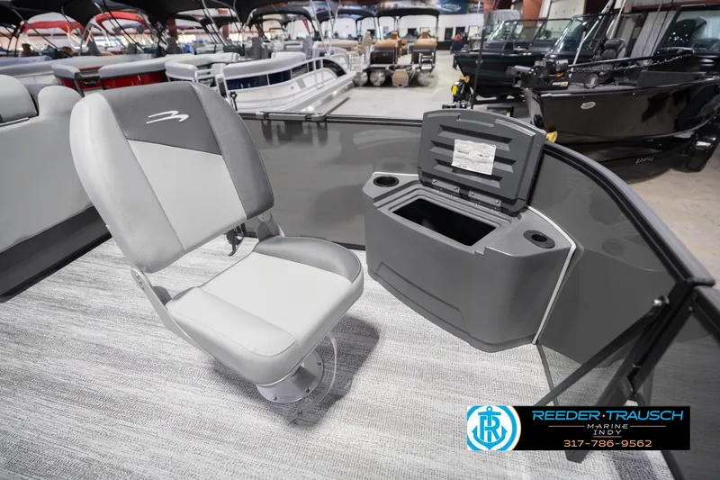 Slide: The Image of 2026 Bennington 22 SF boat interior with gray seating and storage compartment. - 24
