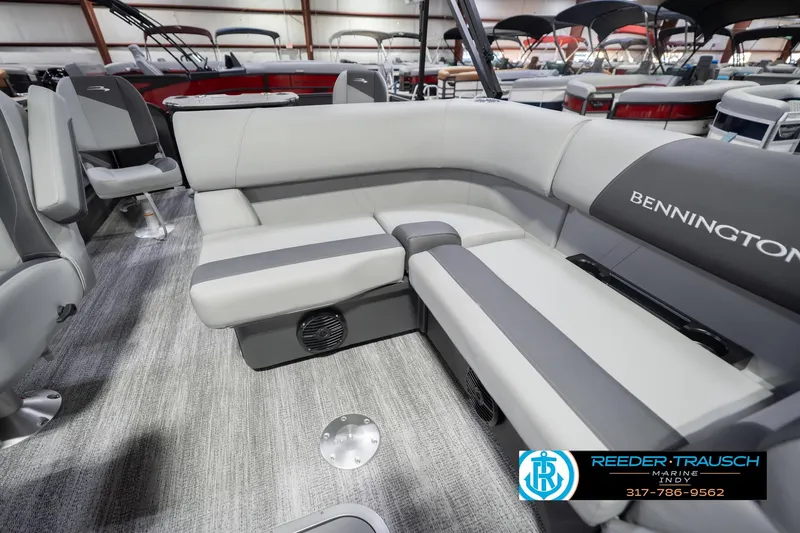 Slide: The Image of 2026 Bennington 22 SF boat interior with gray seating and carpeted flooring. - 26