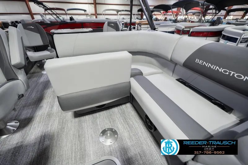 Slide: The Image of 2026 Bennington 22 SF boat interior with gray seating and carpeted flooring. - 28