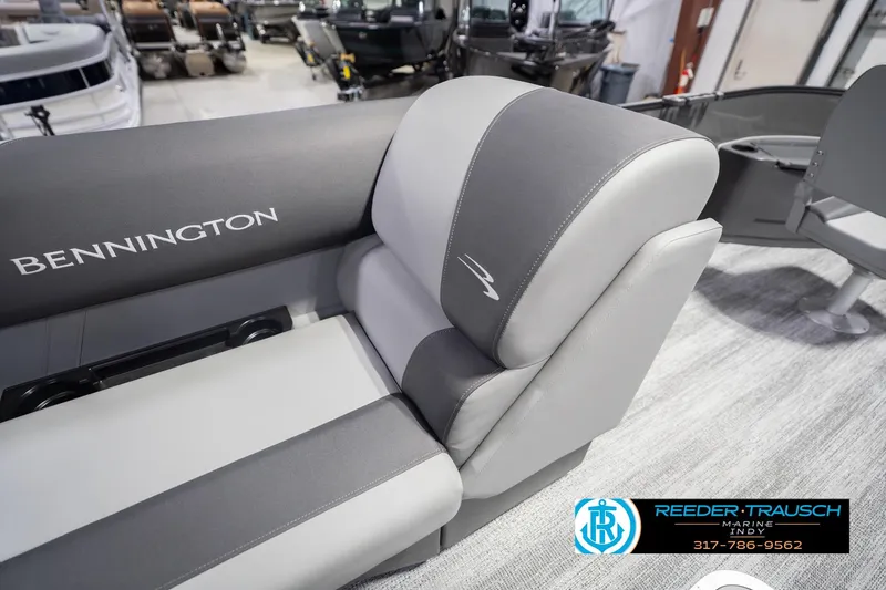 Slide: The Image of 2026 Bennington 22 SF boat interior with gray seating at Reeder-Trausch Marine showroom. - 31
