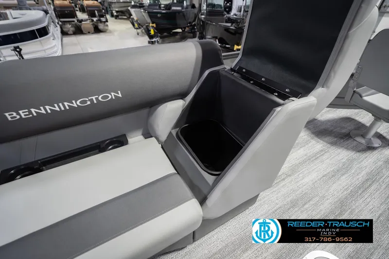 Slide: The Image of 2026 Bennington 22 SF boat interior with open storage compartment, showcasing seating and design. - 32