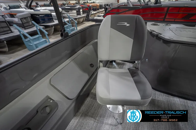 Slide: The Image of 2026 Bennington 22 SF boat interior with gray seating and storage compartment. - 33