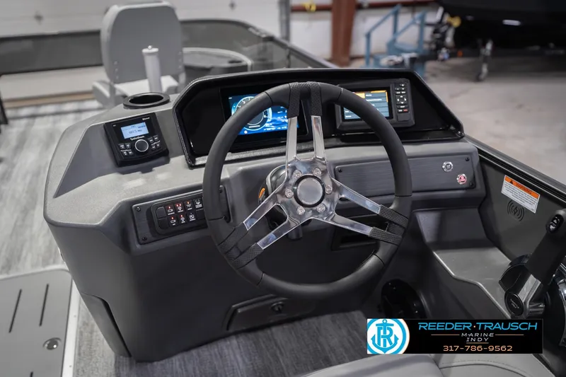 Slide: The Image of 2026 Bennington 22 SF boat dashboard with steering wheel and digital display. - 41