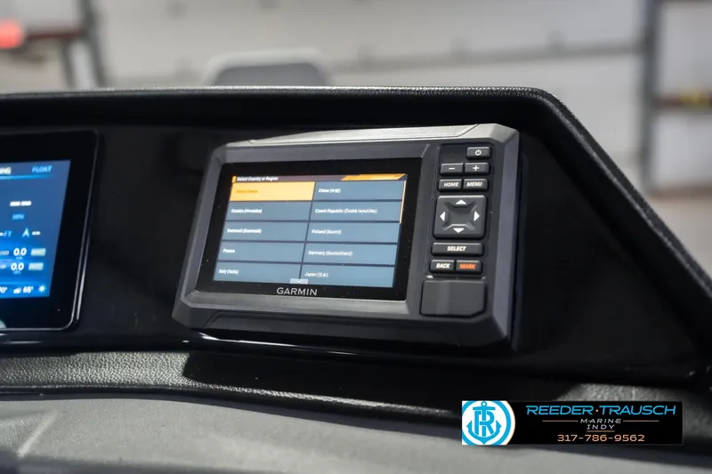 Slide: The Image of Garmin display on 2026 Bennington 22 SF boat dashboard, featuring navigation options. - 46