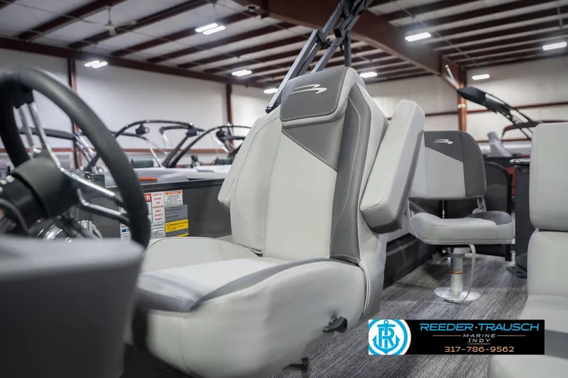 Slide: The Image of 2026 Bennington 22 SF boat interior with gray seating in showroom. - 48