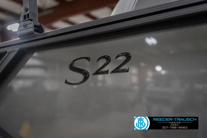 Slide: The Image of 2026 Bennington 22 SF boat with S22 emblem, showcased at Reeder Trausch Marine. - 58