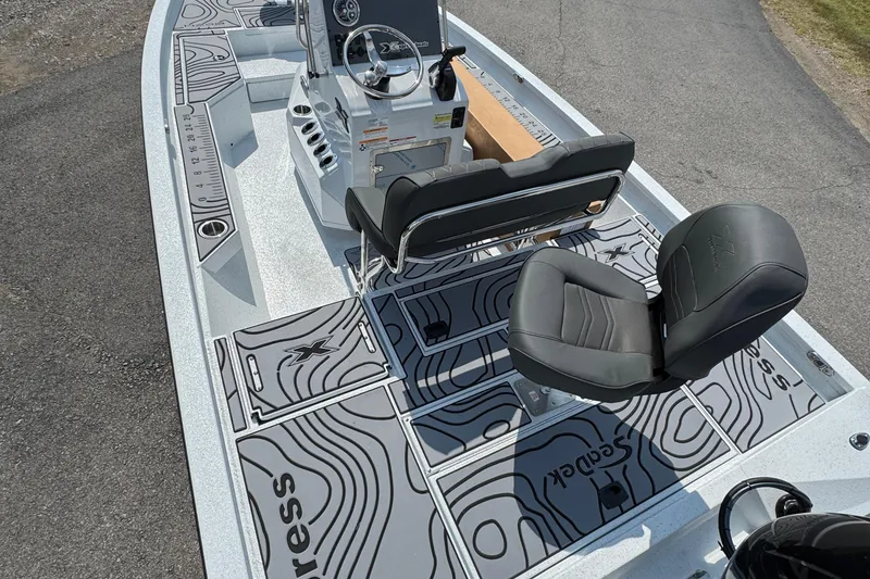 Slide: The Image of 2026 Xpress H20B Bay boat interior with stylish seating and modern dashboard design. - 2