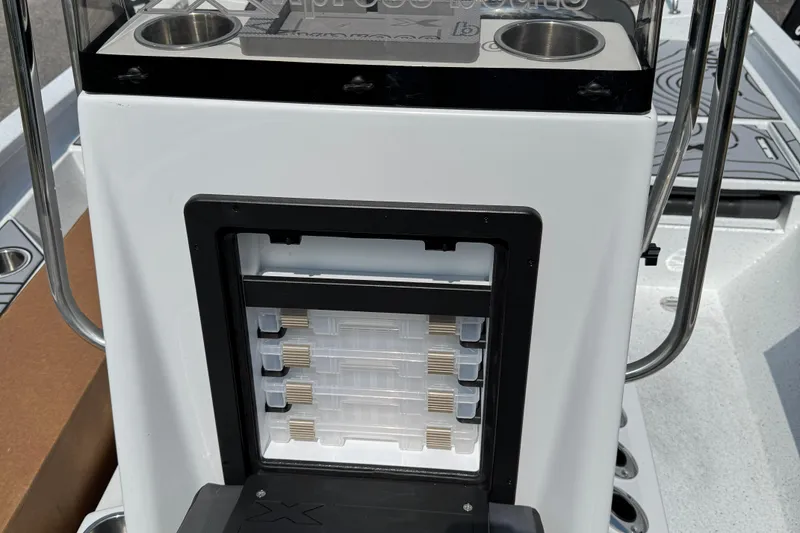 Slide: The Image of 2026 Xpress H20B Bay boat console with storage compartments and cup holders. - 5