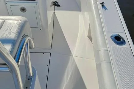 Slide: The Image of 2021 Edgewater 188CC boat interior, featuring sleek white seating and deck design. - 14