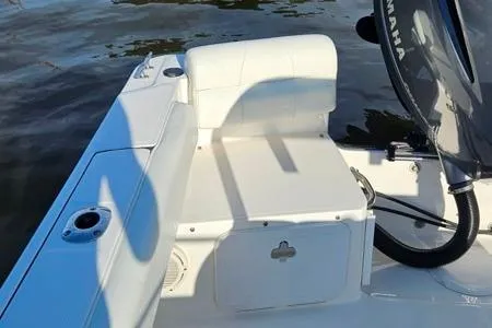 Slide: The Image of 2021 Edgewater 188CC boat interior with seating and Yamaha engine. - 17