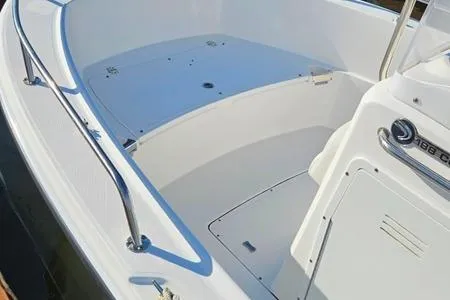 Slide: The Image of 2021 Edgewater 188CC boat interior with sleek white design and stainless steel railings. - 21