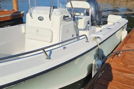 Slide: The Image of 2021 Edgewater 188CC boat docked, featuring sleek design and modern console. - 27