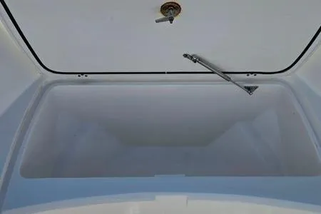 Slide: The Image of 2021 Edgewater 188CC boat storage compartment, open lid, spacious interior. - 6