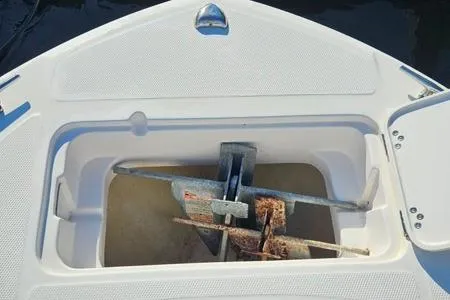 Slide: The Image of 2021 Edgewater 188CC boat anchor storage compartment with anchor and chain. - 7