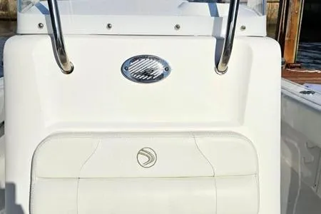 Slide: The Image of 2021 Edgewater 188CC boat console with white seating and chrome accents. - 8