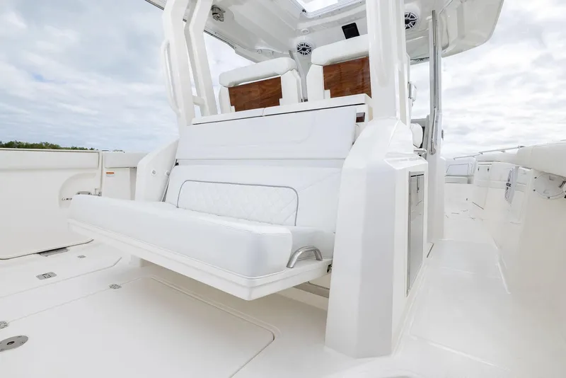 Slide: The Image of Manufacturer Provided Image: 2025 Pursuit S 328 Sport boat interior with white seating and sleek design. - 15