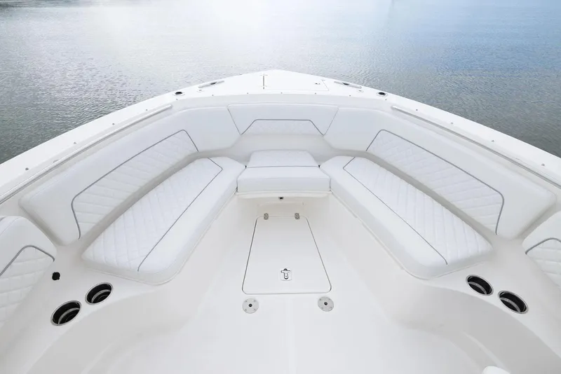 Slide: The Image of Manufacturer Provided Image: Luxurious seating area on 2025 Pursuit S 328 Sport boat, overlooking calm waters. - 6