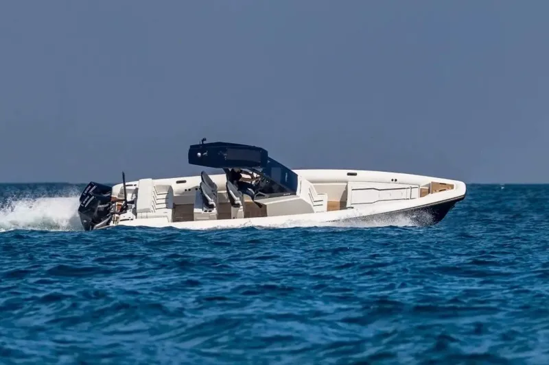 Slide: The Image of 2025 Technohull GTX boat cruising on open water. - 10