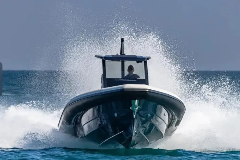 Slide: The Image of 2025 Technohull GTX speeding on ocean, creating dynamic water spray. - 11