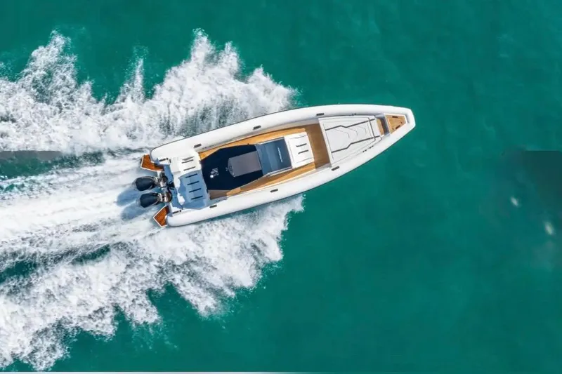 Slide: The Image of Aerial view of 2025 Technohull GTX speedboat cruising on turquoise water. - 19