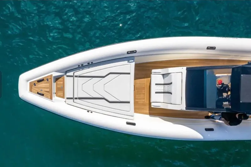 Slide: The Image of Top view of 2025 Technohull GTX boat on clear blue water. - 3