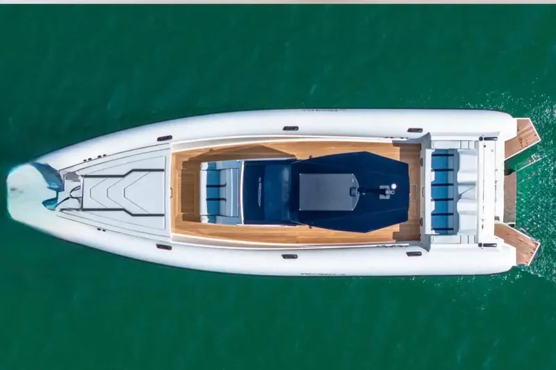 Slide: The Image of Aerial view of 2025 Technohull GTX yacht on turquoise water. - 5