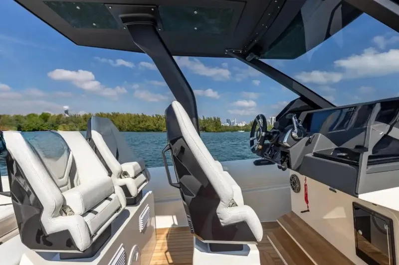 Slide: The Image of Interior of 2025 Technohull GTX boat with modern seating and steering console. - 8
