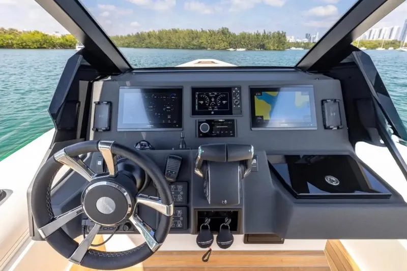 Slide: The Image of 2025 Technohull GTX dashboard with modern navigation and control systems on a sunny day. - 9