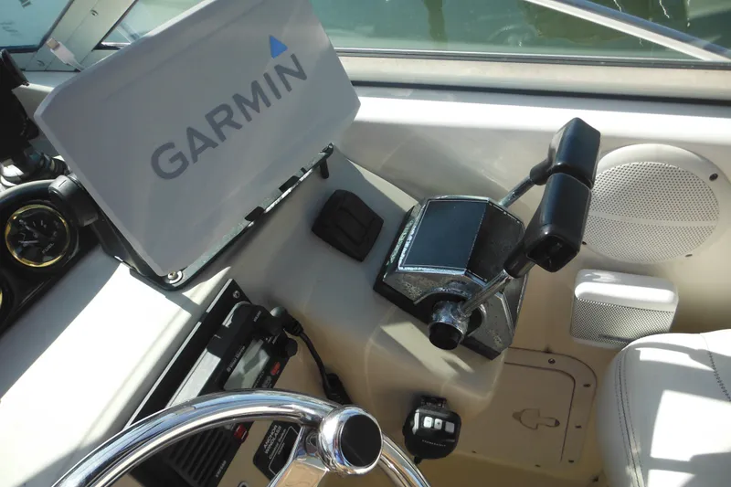Slide: The Image of Cockpit of 2000 Rinker 330 Fiesta Vee with Garmin navigation system and controls. - 16