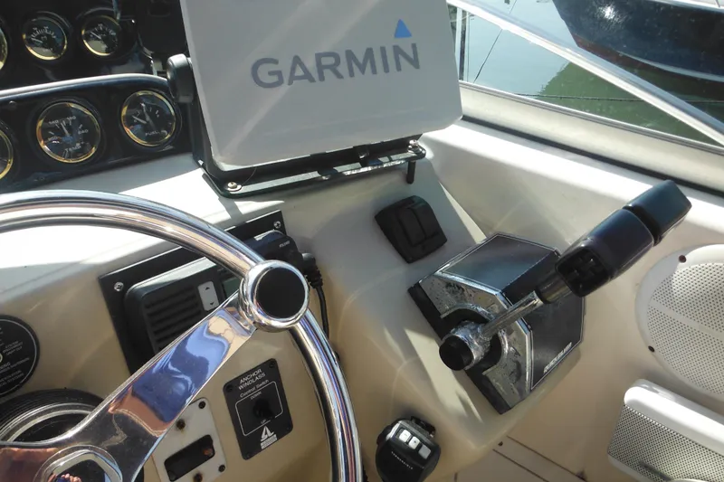 Slide: The Image of Control panel of 2000 Rinker 330 Fiesta Vee boat with Garmin navigation system. - 19