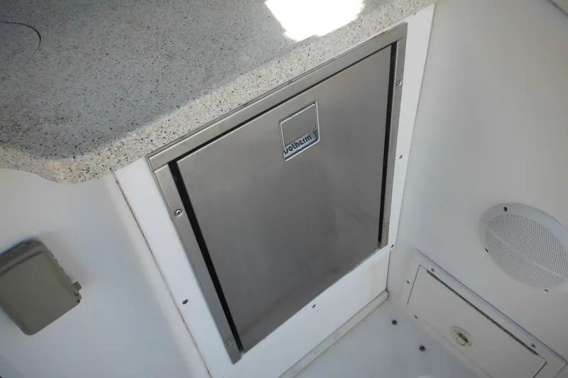 Slide: The Image of Rinker 330 Fiesta Vee 2000 boat interior with stainless steel cabinet and countertop. - 26